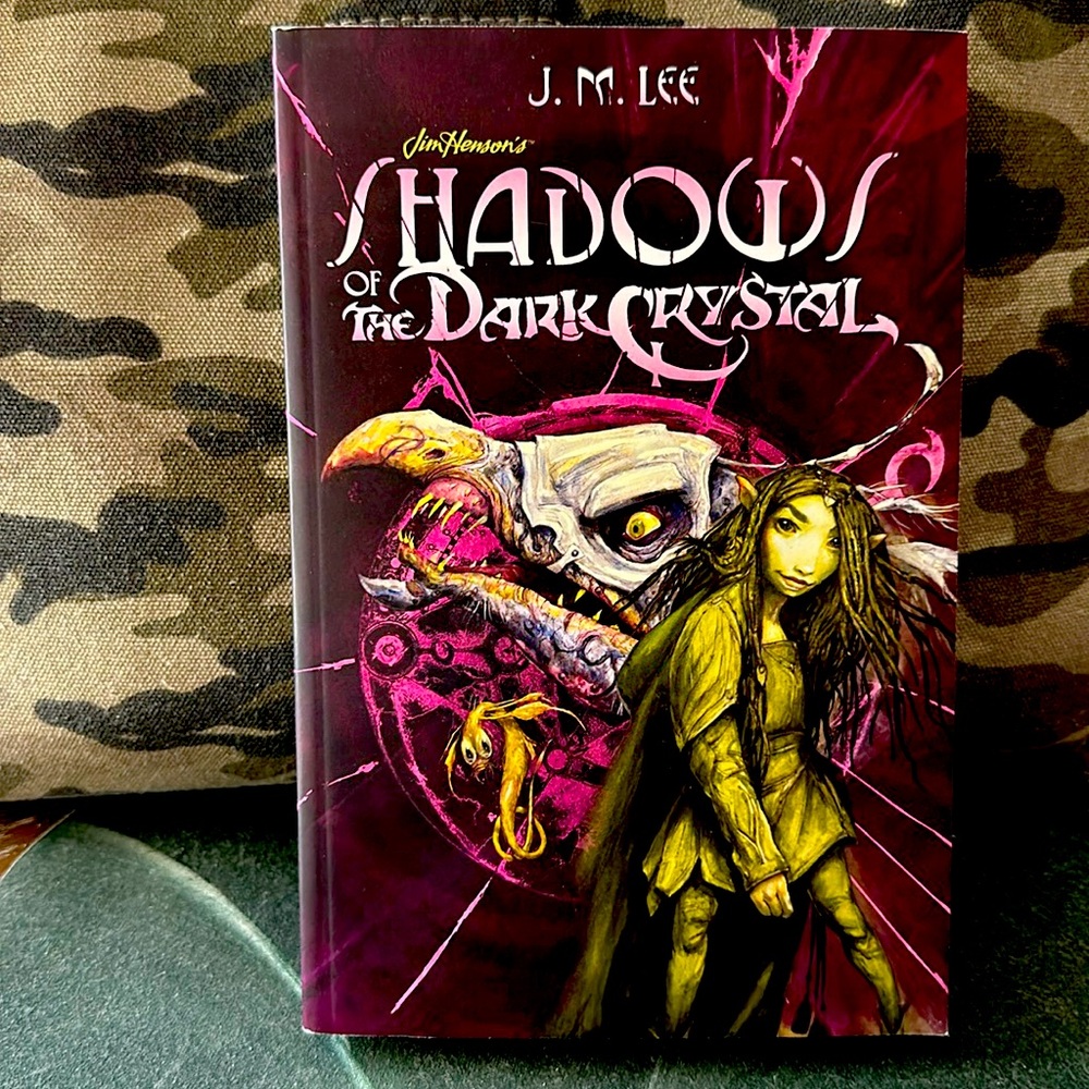 Shadows of the Dark Crystal paperback book and Pluff’M pin